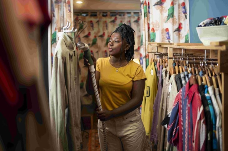 woman-cleaning-clothing-thrift-store 2 (1)